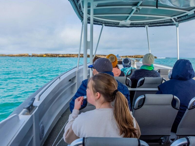 Boat tour group enjoying a ride onboard Observer