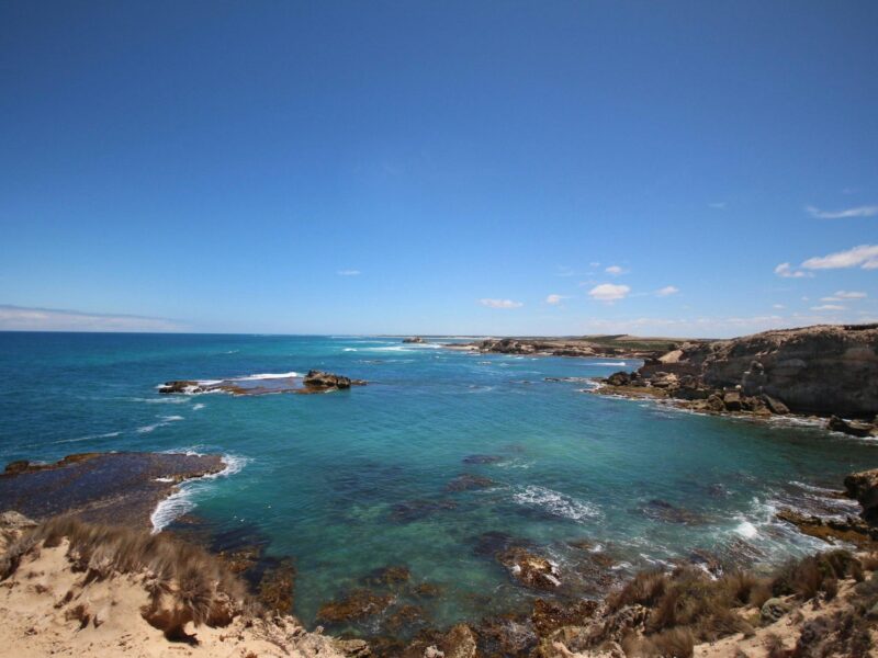 The sea cliffs overlooking the blue water at Douglas Point Conservation Park