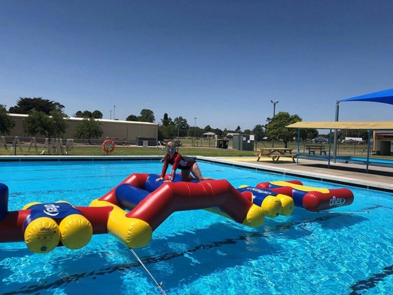 children playing on the Inflatable obstacle course at Penola Pool