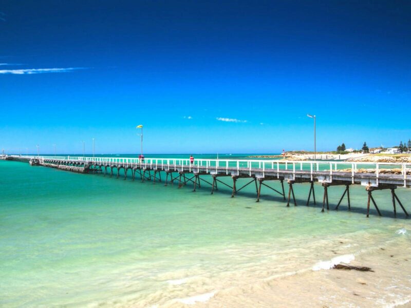 The iconic Beachport Jetty extends over the waters of Rivoli Bay.