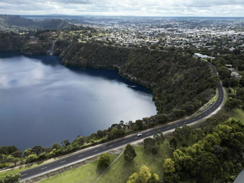 ATDW Mount Gambier.jpeg lake in a volcanic crater with city in the background
