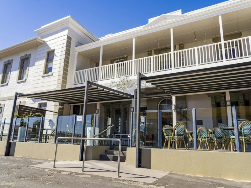 ATDW The Bushmans Arms Hotel.jpeg Front of The Bushman’s Arms Hotel featuring a spacious alfresco dining area and elegant architecture