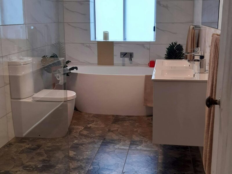 Main Bathroom with walk in shower and bath