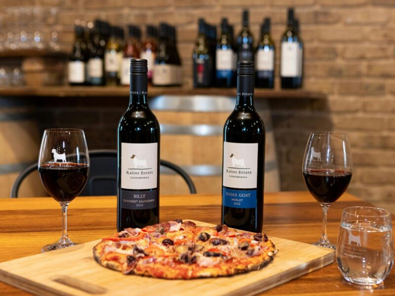 ATDW Fathers Day Pizza Tunes.jpeg Pizza and Wine on a table