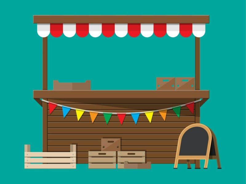 Colouful image of a market stall with coloured banners