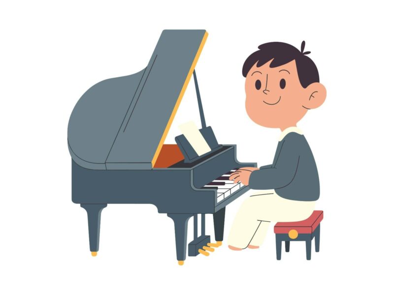 A cartoon drawing of a man playing a grey piano with the top up. He is smiling wearing a grey jumper