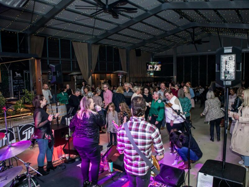 People dancing and singing at night time