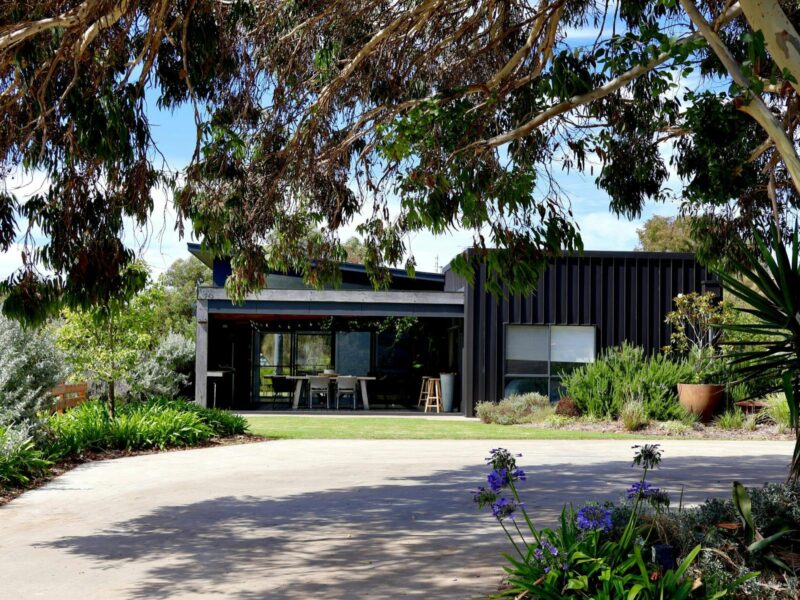 Exterior view of Harolds on the Hill showing landscaped gardens, lawn area and sheltered outdoor ent